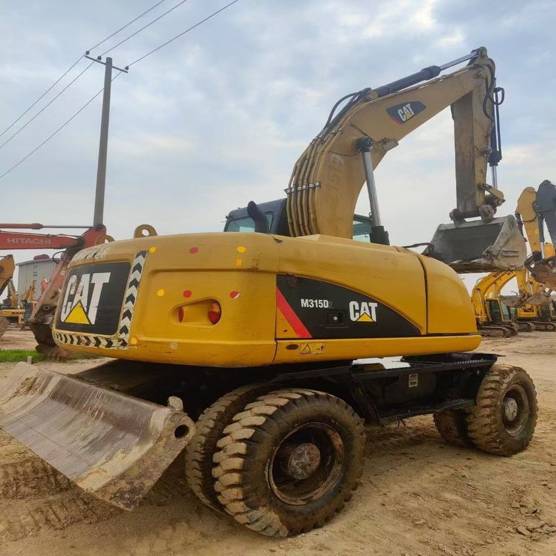Le chat original M315D d'excavatrice d'occasion a utilisé une pelle sur pneus de 15 tonnes avec un godet de 0,61 m3
