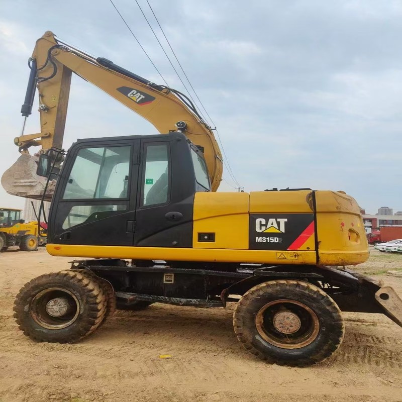 Le chat original M315D d'excavatrice d'occasion a utilisé une pelle sur pneus de 15 tonnes avec un godet de 0,61 m3